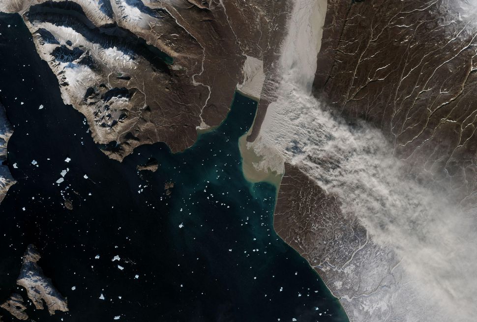 NASA sees rare ‘glacial flour’ dust streaming over Greenland